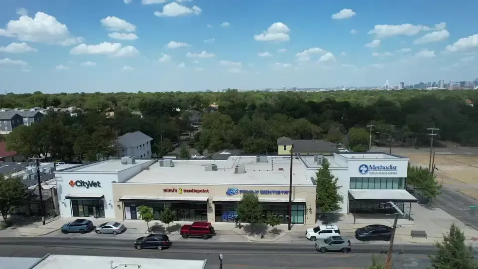Aerial view along West Davis Street in Bishop Arts, ending on the Arts Family Dentistry storefront