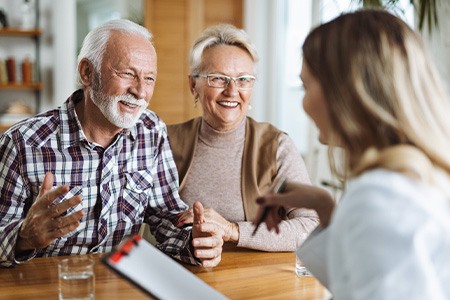 Couple talking to a receptionist