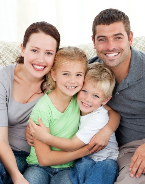 Family smiling together after visiting their Dallas Texas dental office
