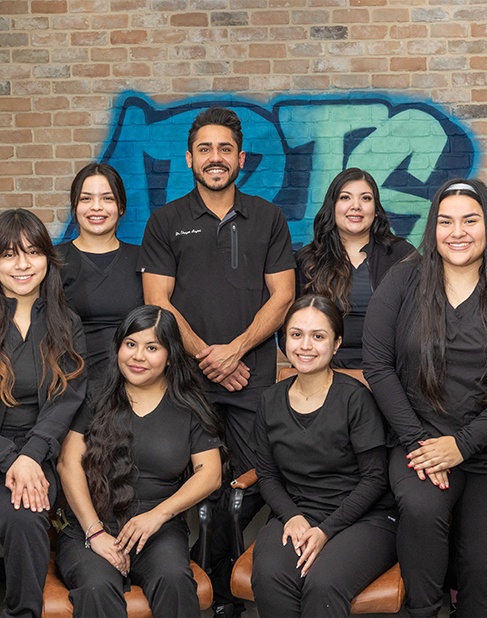 Family smiling together after visiting their Dallas Texas dental office