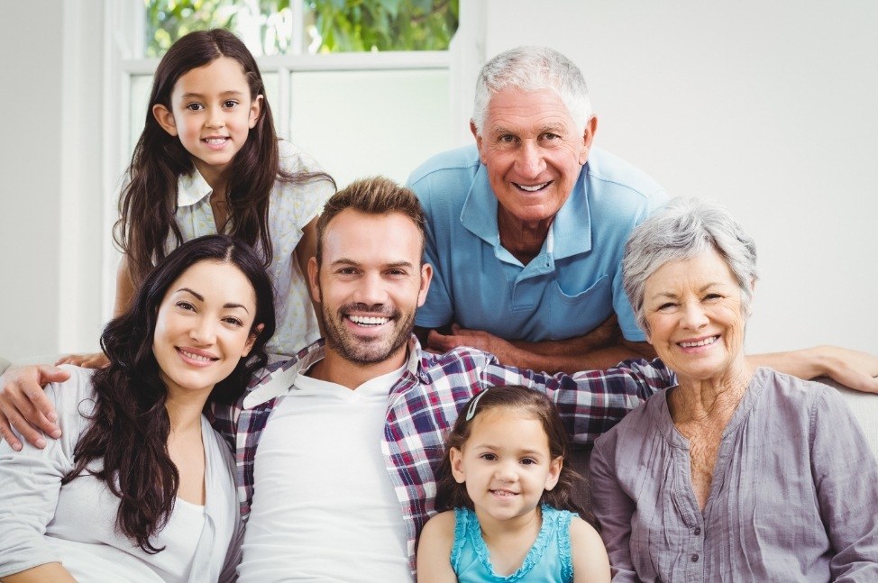 Three generations of family smiling together