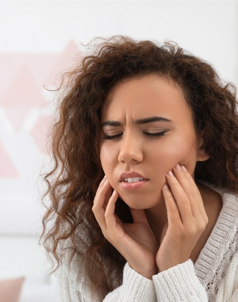 Woman in pain before emergency dentistry