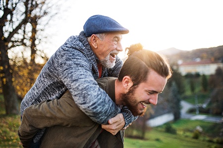 a mature man enjoying benefits of dental implants in Dallas