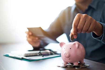 piggy bank representing the cost of dental implants in Dallas