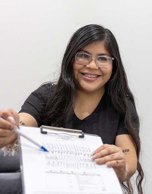 Patient turning in dental insurance forms