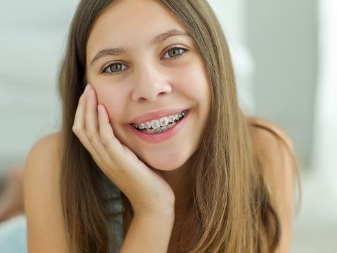 Teen with traditional orthodontics