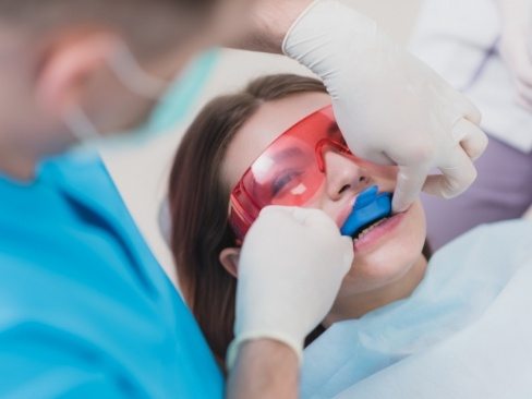 Dental patient receiving fluoride treatment